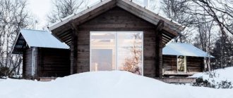 The bathhouse attached to the left looks harmonious with the one-story guest house