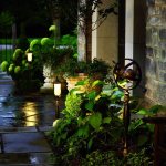 Solar-powered lanterns near the porch of the house