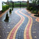 Paving a yard in a suburban area with paving slabs