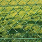 Green mesh netting on a garden fence